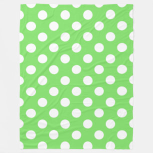 White polka dots on apple green fleece blanket