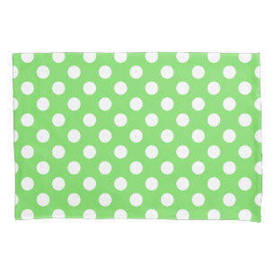 White polka dots on apple green pillowcase
