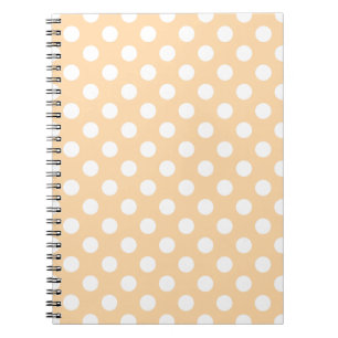 White polka dots on beige notebook