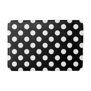 White polka dots on black bath mat