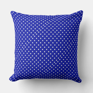 white polka dots on blue cushion