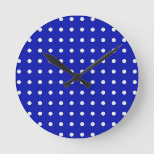 white polka dots on blue round clock