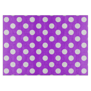 White polka dots on bright purple cutting board