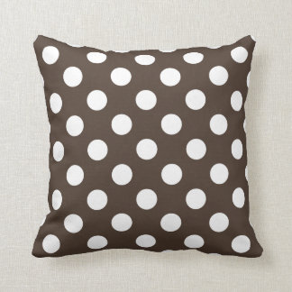White polka dots on brown cushion