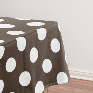 White polka dots on brown tablecloth