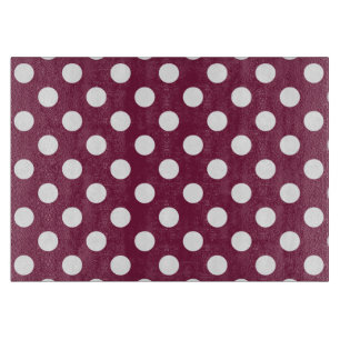 White polka dots on burgundy cutting board