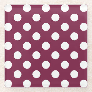 White polka dots on burgundy glass coaster