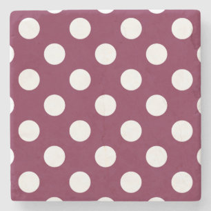 White polka dots on burgundy stone coaster