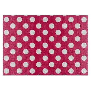 White polka dots on cerise cutting board