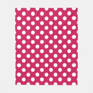 White polka dots on cerise fleece blanket