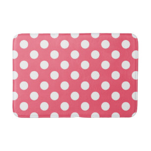 White polka dots on coral bath mat