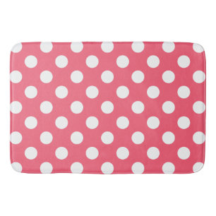 White polka dots on coral bath mat