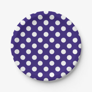 White polka dots on dark blue paper plate