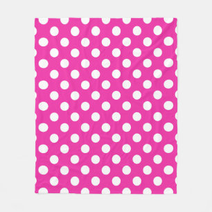 White polka dots on fuchsia fleece blanket