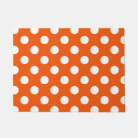 White polka dots on orange