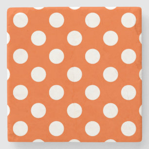 White polka dots on orange stone coaster