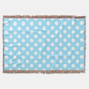 White polka dots on pale blue throw blanket