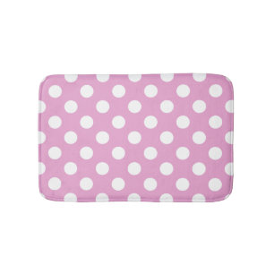 White polka dots on pale pink bath mat