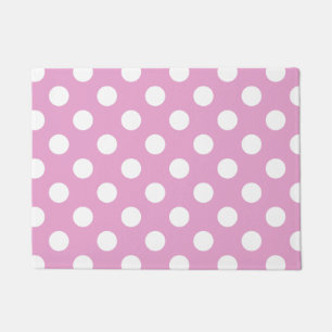 White polka dots on pale pink doormat