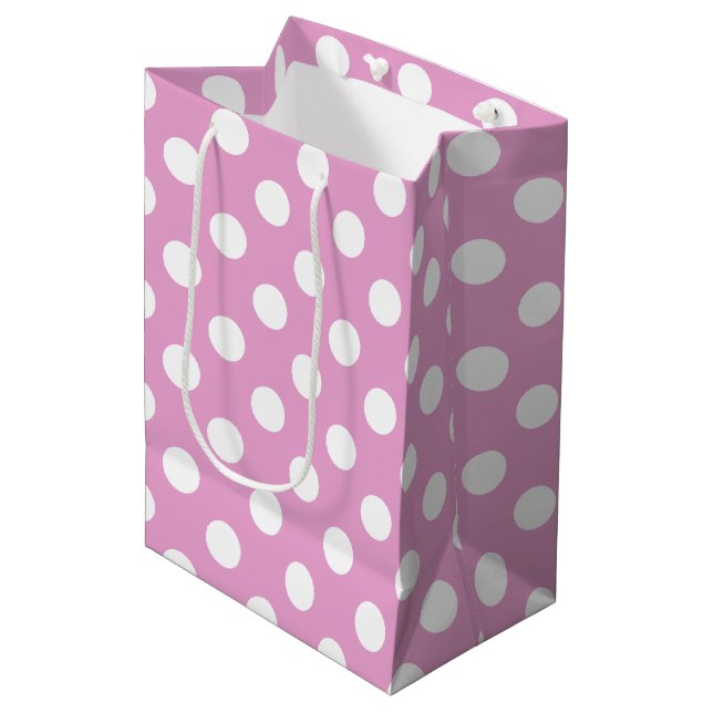 White polka dots on pale pink medium gift bag (Front Angled)