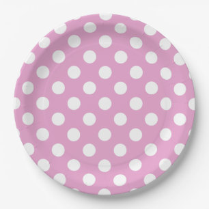 White polka dots on pale pink paper plate