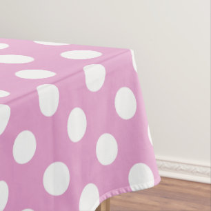 White polka dots on pale pink tablecloth
