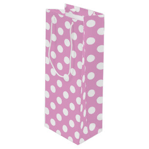 White polka dots on pale pink wine gift bag
