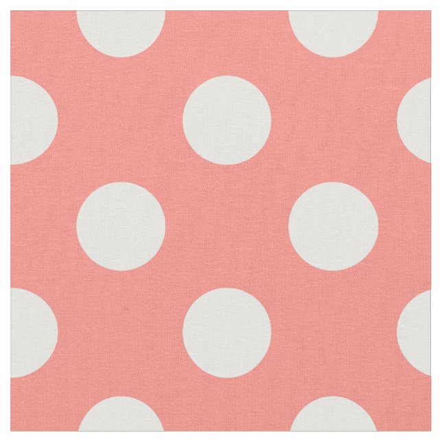 White polka dots on peach fabric (Close Up)