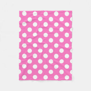 White polka dots on pink fleece blanket