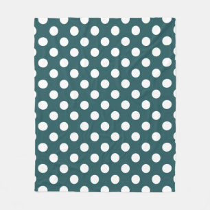 White polka dots on teal fleece blanket