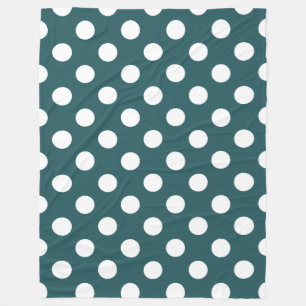 White polka dots on teal fleece blanket