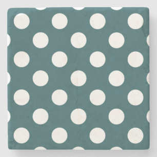 White polka dots on teal stone coaster