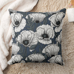 White poppies on navy cushion