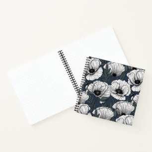 White poppies on navy notebook