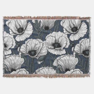 White poppies on navy throw blanket