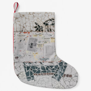 White printer paper on white and grey concrete wal small christmas stocking