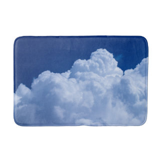 White puffy clouds and blue sky bath mat