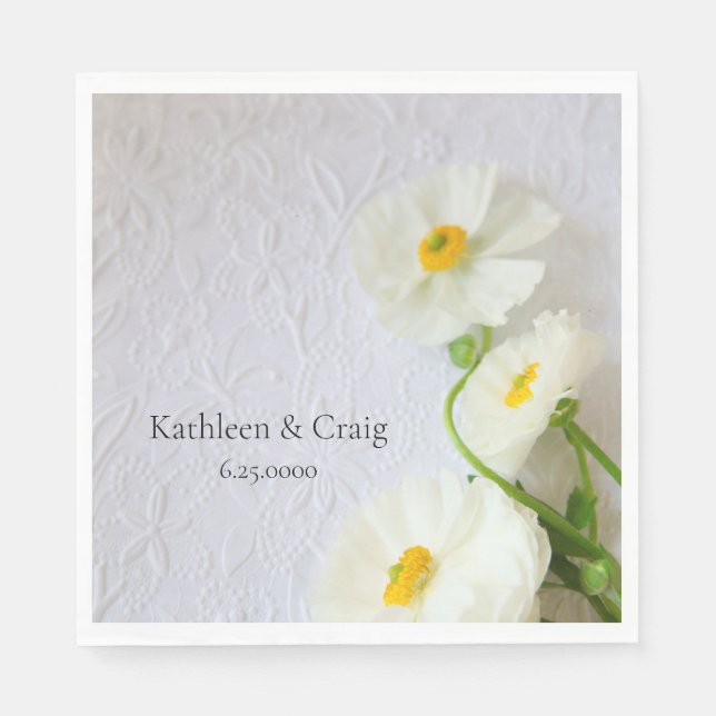 White ranunculus on textured paper napkin (Front)