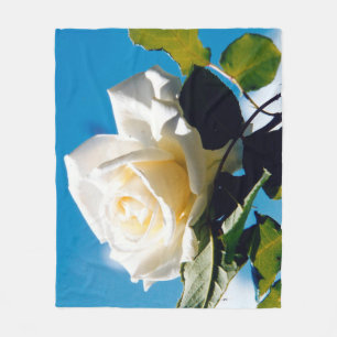 White rose under blue sky fleece blanket