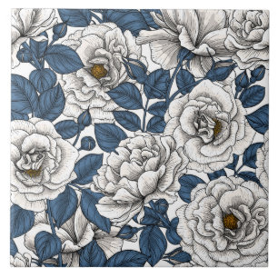 White roses with blue leaves on white ceramic tile