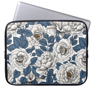White roses with blue leaves on white laptop sleeve