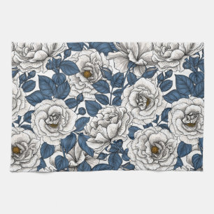 White roses with blue leaves on white tea towel