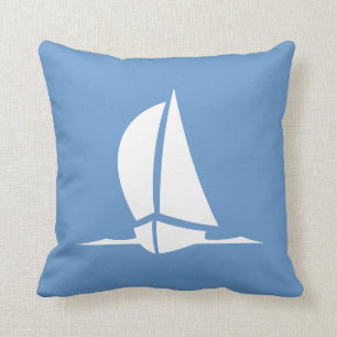 white sailboat on blue pillow