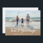 White Seas and Greetings  Beach Christmas Holiday Card<br><div class="desc">A clever take on the traditional holiday card features your favourite beach photo with Seas & Greetings in a modern white script . Personalise with your family name and the year.</div>