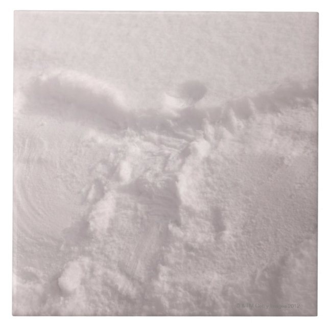 White snow imprinted with a snow angel ceramic tile (Front)