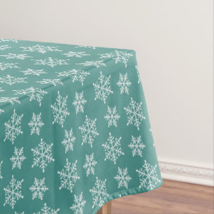 White Snowflake Pattern on Teal Tablecloth