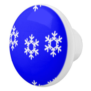 White snowflakes on blue ceramic knob