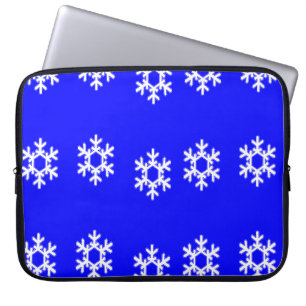 White snowflakes on blue laptop sleeve