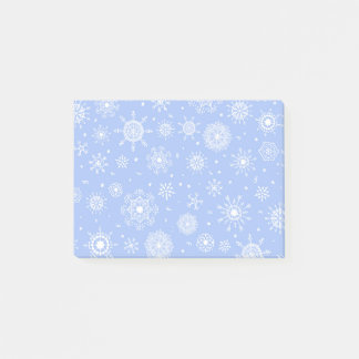 White snowflakes on blue post-it notes