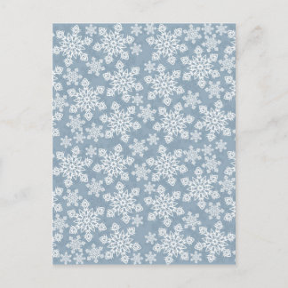 white snowflakes on blue postcard